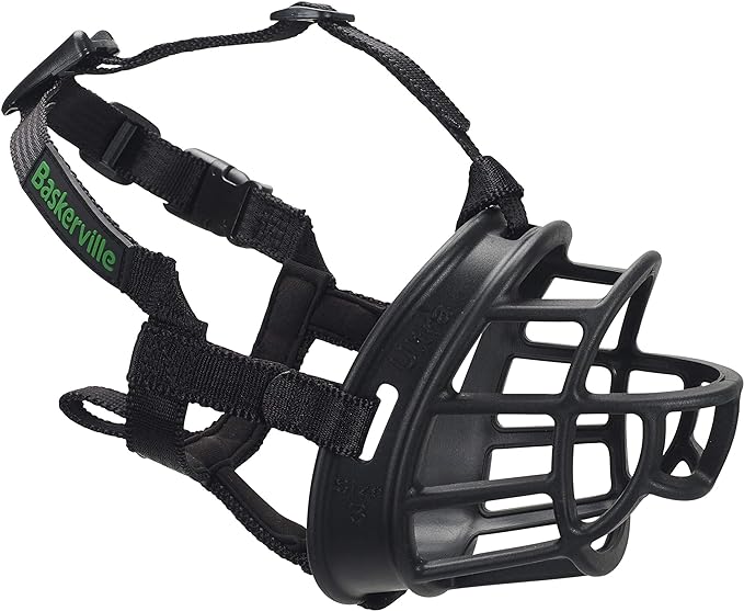 a black basketmuzzle with a green logo on side saying 'Baskerville'